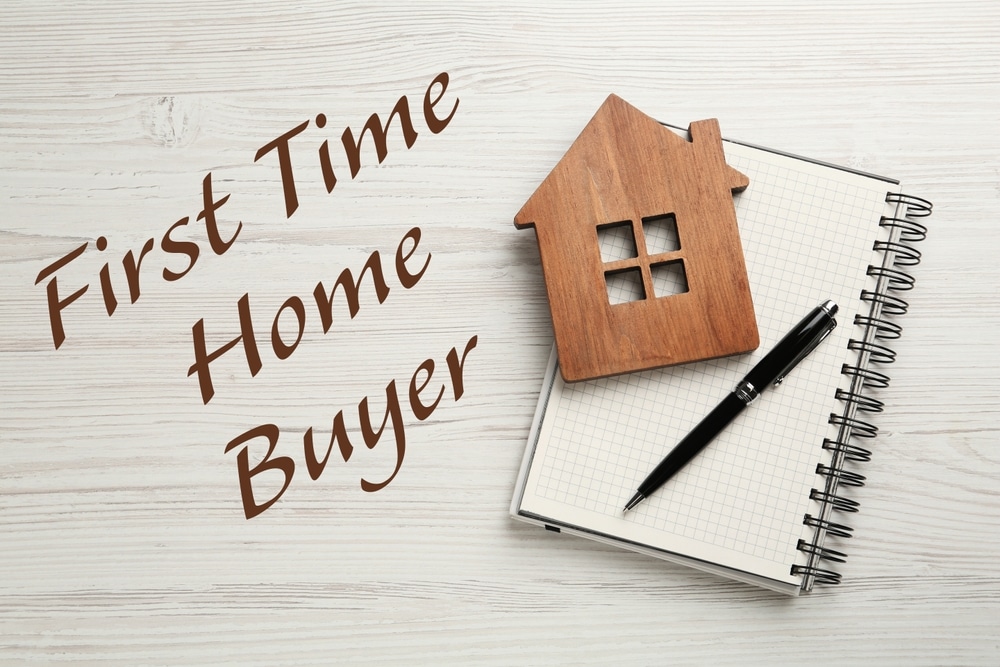 FirstTimeHomeBuyerHouseFigurePenAndNotebookOn